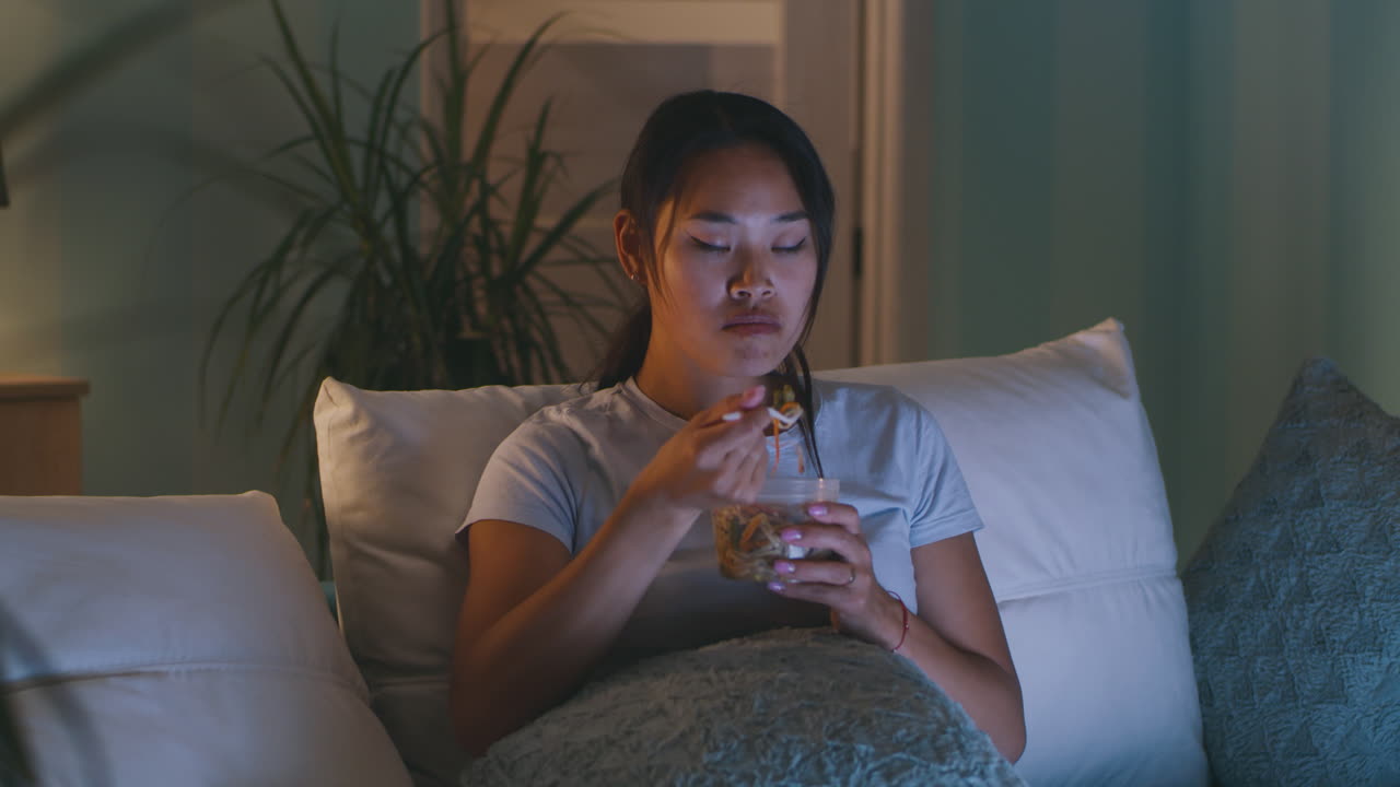 Young Woman Eating Late Night Snack