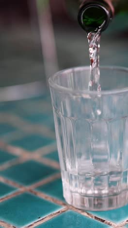 sequence of sake being poured into a glass