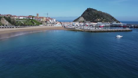 Lone-SUP-paddle-boarder-enjoys-quiet-sunny-morning-on-Spanish-beach