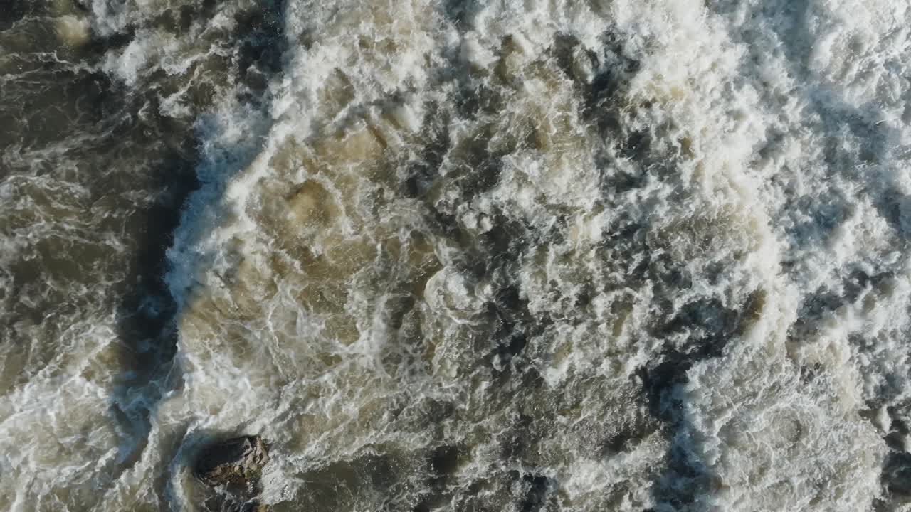 Rushing water cascades down the waterfall at Owen Sound, Canada, aerial view