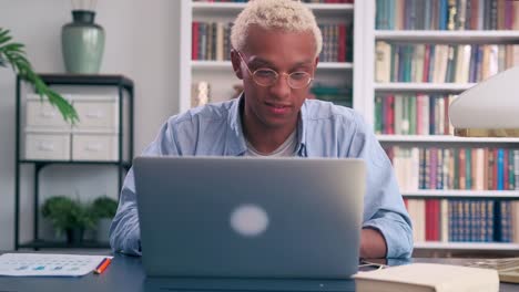 young african american man starts working or doing online learning on laptop