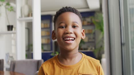 video of happy african american boy looking at camera