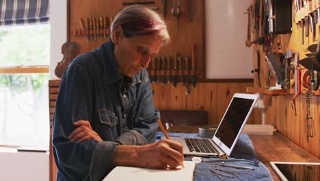 Female luthier at work in her workshop