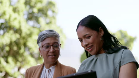 tablet, talking and walking with a business woman