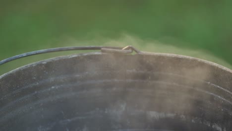 hot metal wash bucket filled with water