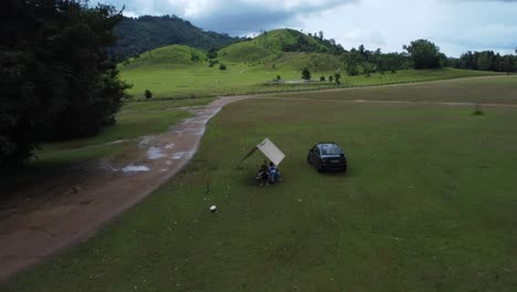 Tourists-capture-drone-footage-of-green-valley-at-Phu-Khao-Ya,-Nago,-Thailand