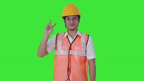 Happy-Indian-architect-showing-victory-sign-Green-screen