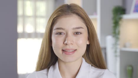 young girl smiling at camera.