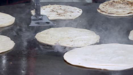 indian flatbread cooking on a griddle