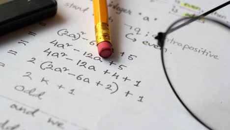 Hand writing algebra equations on a paper