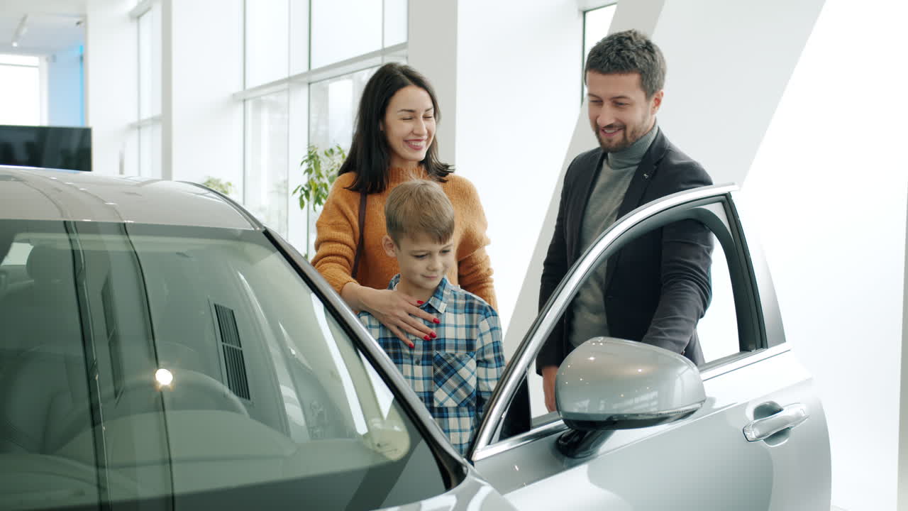 Family Visits a Car Dealership