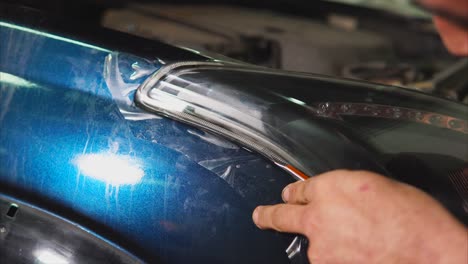 installing protective film on car headlight