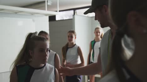 female hockey players going out of dressing room