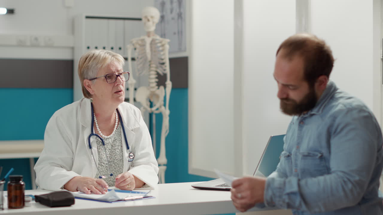 Senior medic and sick patient attending health checkup visit