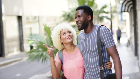 A-diverse-couple-is-enjoying-a-stroll-together-on-a-city-break-vacation