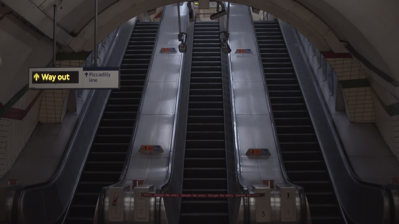 London City Lockdown Piccadilly Circus Tube Subway Underground Station empty and abandoned during 2020 Coronavirus Pandemic with empty moving escalators
