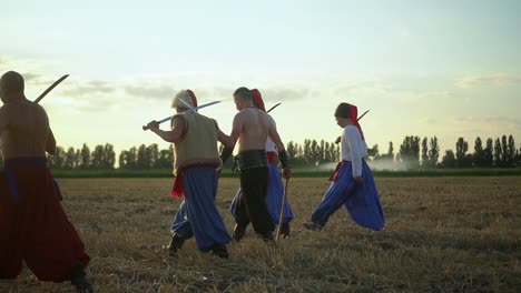 group of cossack men in traditional clothes swinging and spinning sharp shashkas 01