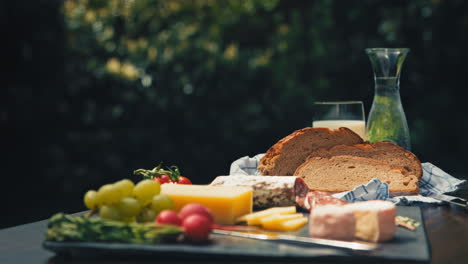 vibrant outdoor table featuring delicious snacks like salami, cheese, and bread with decorations. perfect for food blogs, picnic promotions, or gourmet product showcases