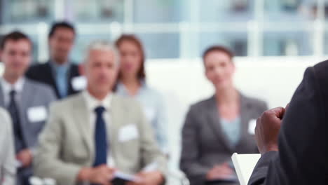 Man-gesturing-while-giving-a-speech