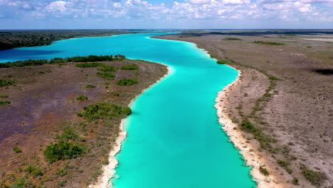 cinematic revealing drone shot of amazing blue waters at bacalar mexico