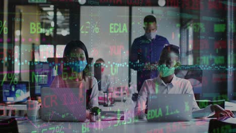 Animation-of-trading-board-and-graph-on-diverse-coworkers-wearing-mask-talking-and-working-on-laptop