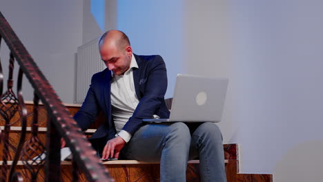 entrepreneur checking documents on laptop overworking