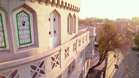 details of the needle-shaped windows of the sermini palace in the santa isabel neighborhood of providencia at sunset in santiago chile