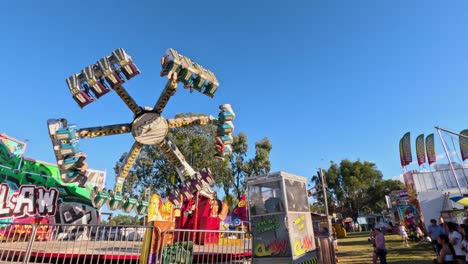 carnival ride rotating with excited passengers