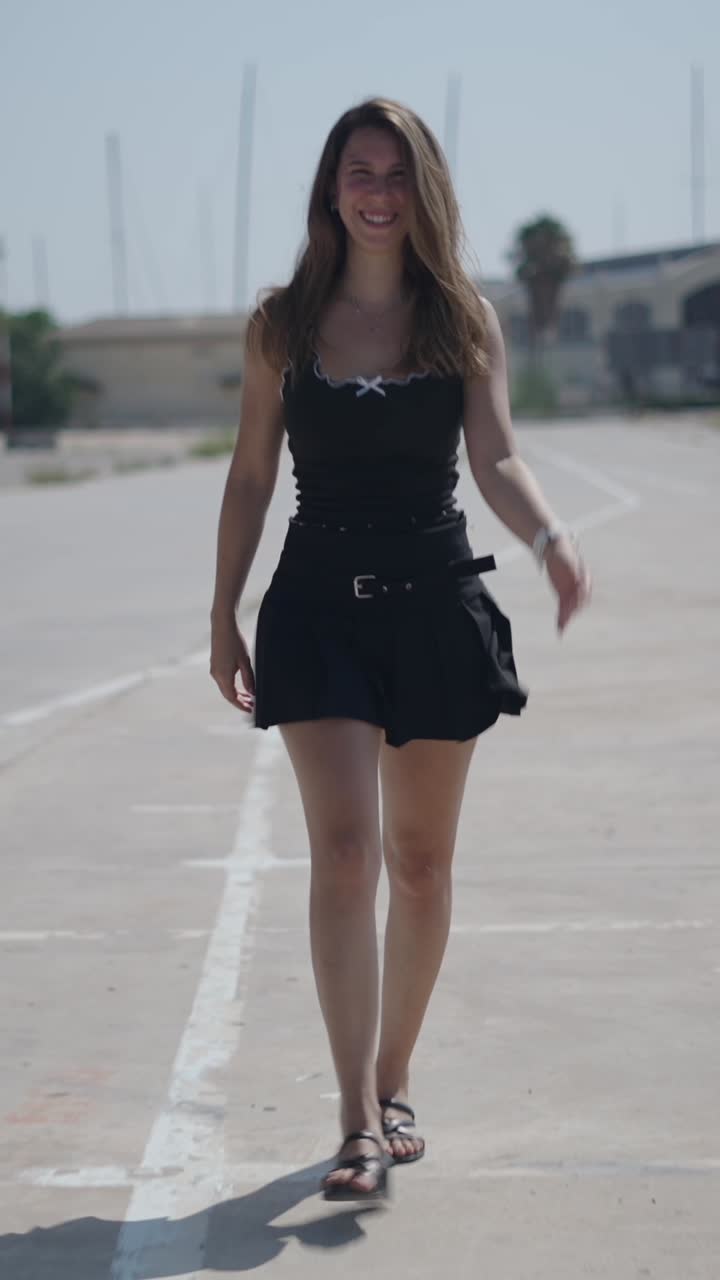 Woman in black skirt and top outdoors