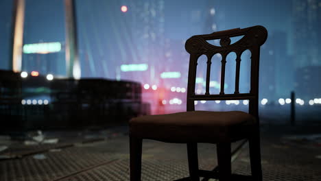 a chair in an empty city at night