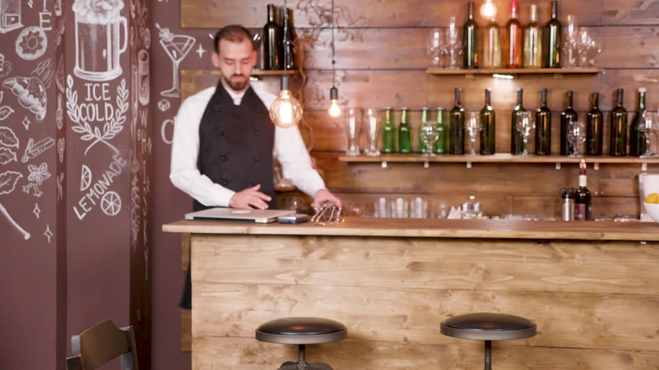 Inside a bar with smart lights and a bartender