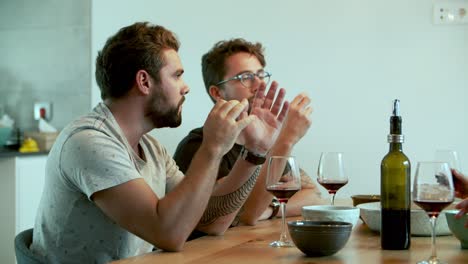 focused bearded man talking and gesturing