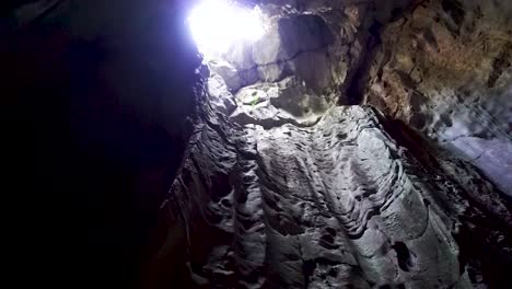 cave with light at the top at marble mountains, da nang vietnam