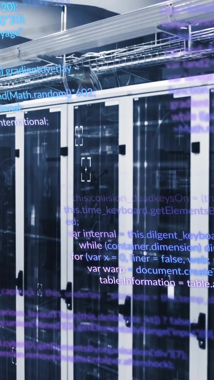 Animation of multicolored computer language over data server racks in server room