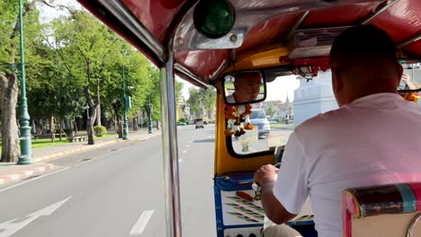 passenger's perspective of a city tuk-tuk journey