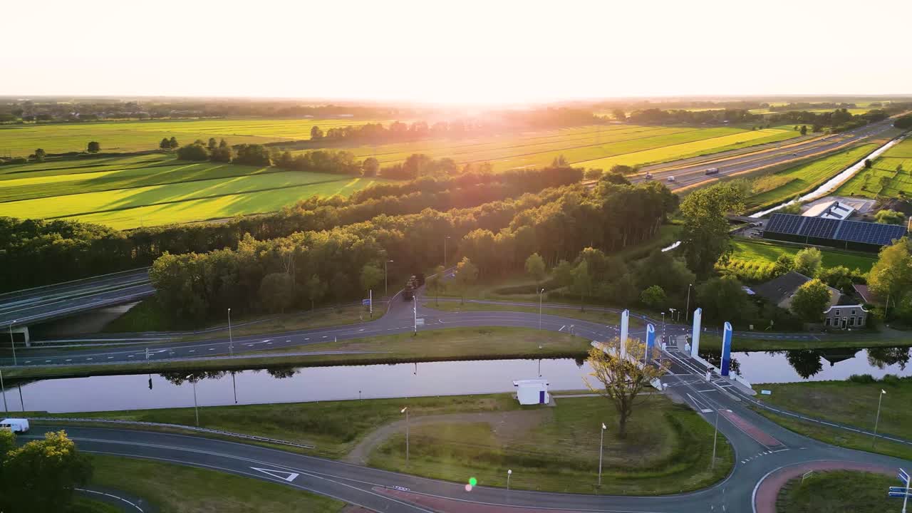 Aerial View of Highway and Canal Bridge Junction in Rural Area