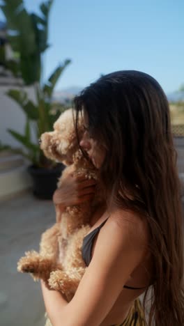 woman hugging a dog outdoors