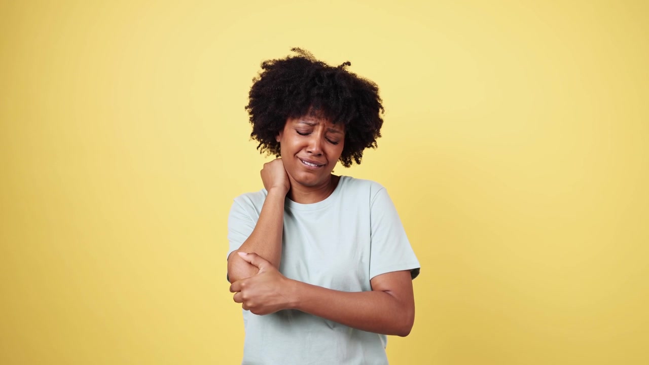 Young African American Woman Suffering from Elbow Pain