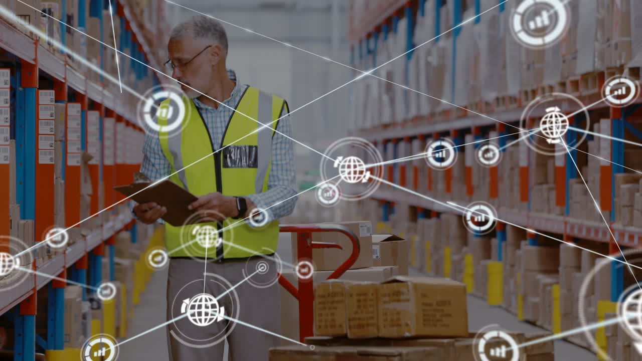 Animation of networks of connection with icons over caucasian man working in warehouse
