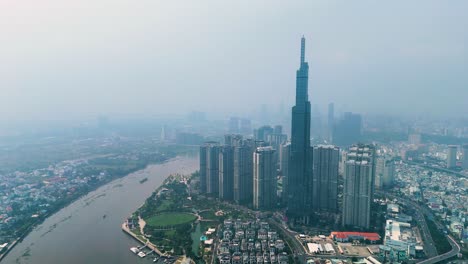 zoomed-out drone shot of the landmark 81 supertall skyscraper during the day in ho chi minh city, vietnam
