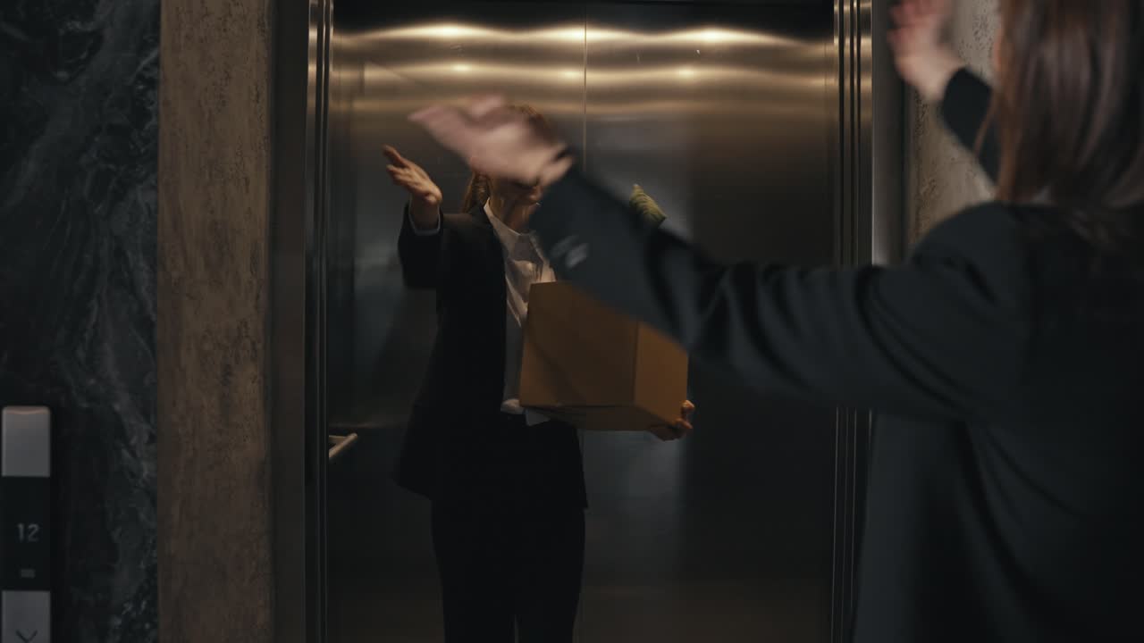 Two businesswomen in an elevator