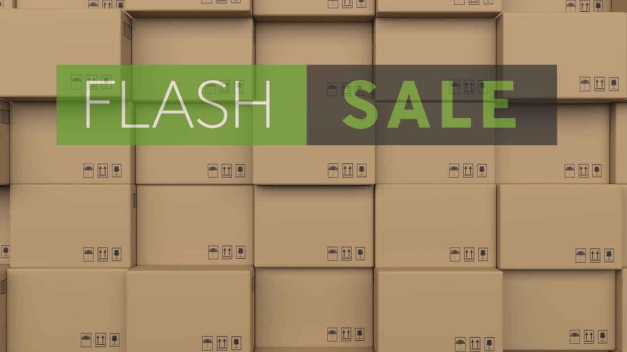 Animation of flash sale text over stack of cardboard boxes in warehouse
