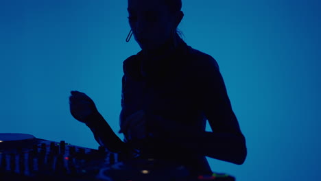 female dj performing at a nightclub