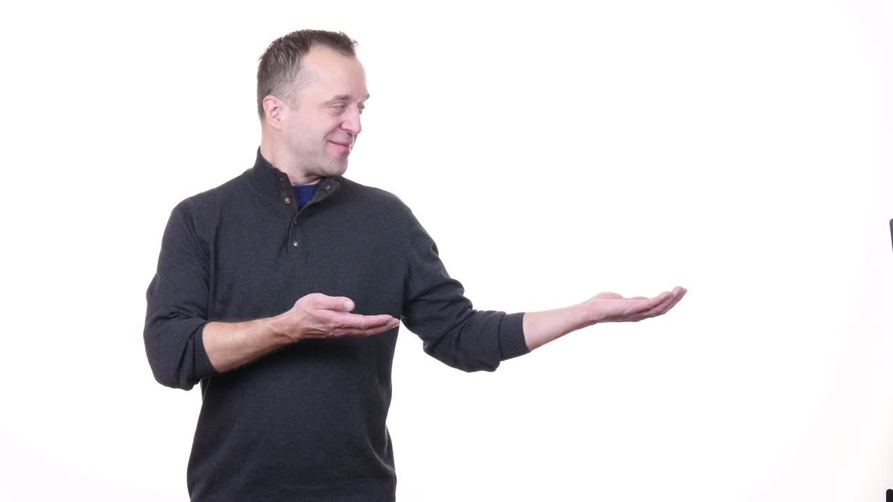 Man presenting showing with hand in copy space
