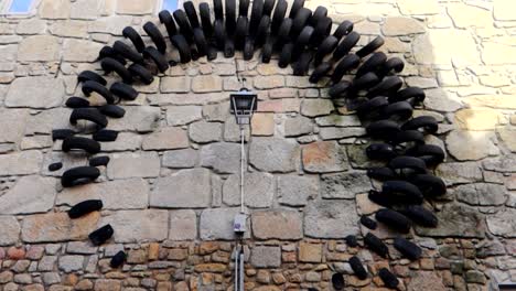 lamp post street art with car tires surrounding it simulating a clock