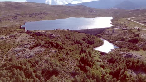 An-aerial-drone-recording-showcasing-the-highest-point-of-Serra-de-Estrella-in-Portugal