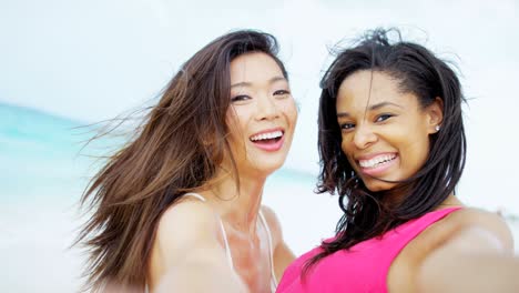 portrait of multi ethnic female on ocean beach