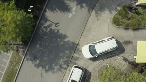 Cars-in-queue-at-a-fast-food-pickup-window-placing-order-during-coronavirus-pandemic-drone-flyover