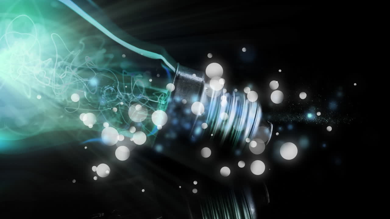 Animation of lit light bulb with glowing flickering spots and copy space