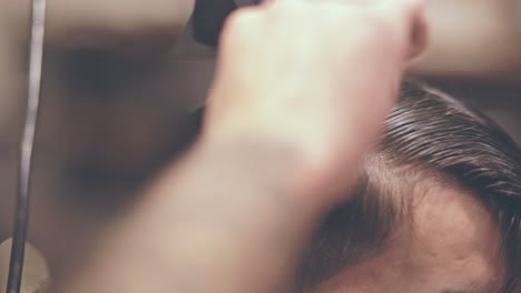 male hairdressing. drying hair man. male hairstyling. hairdresser blowing hair